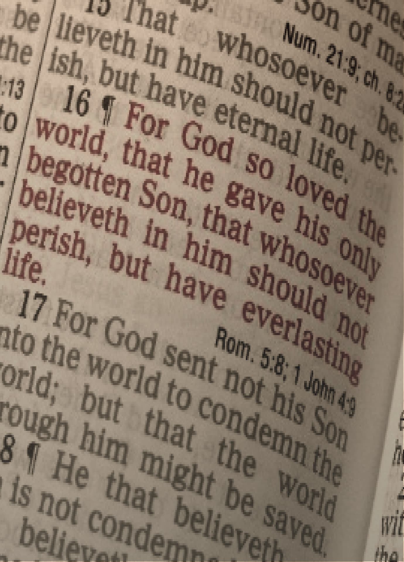 An open bible on a wooden table