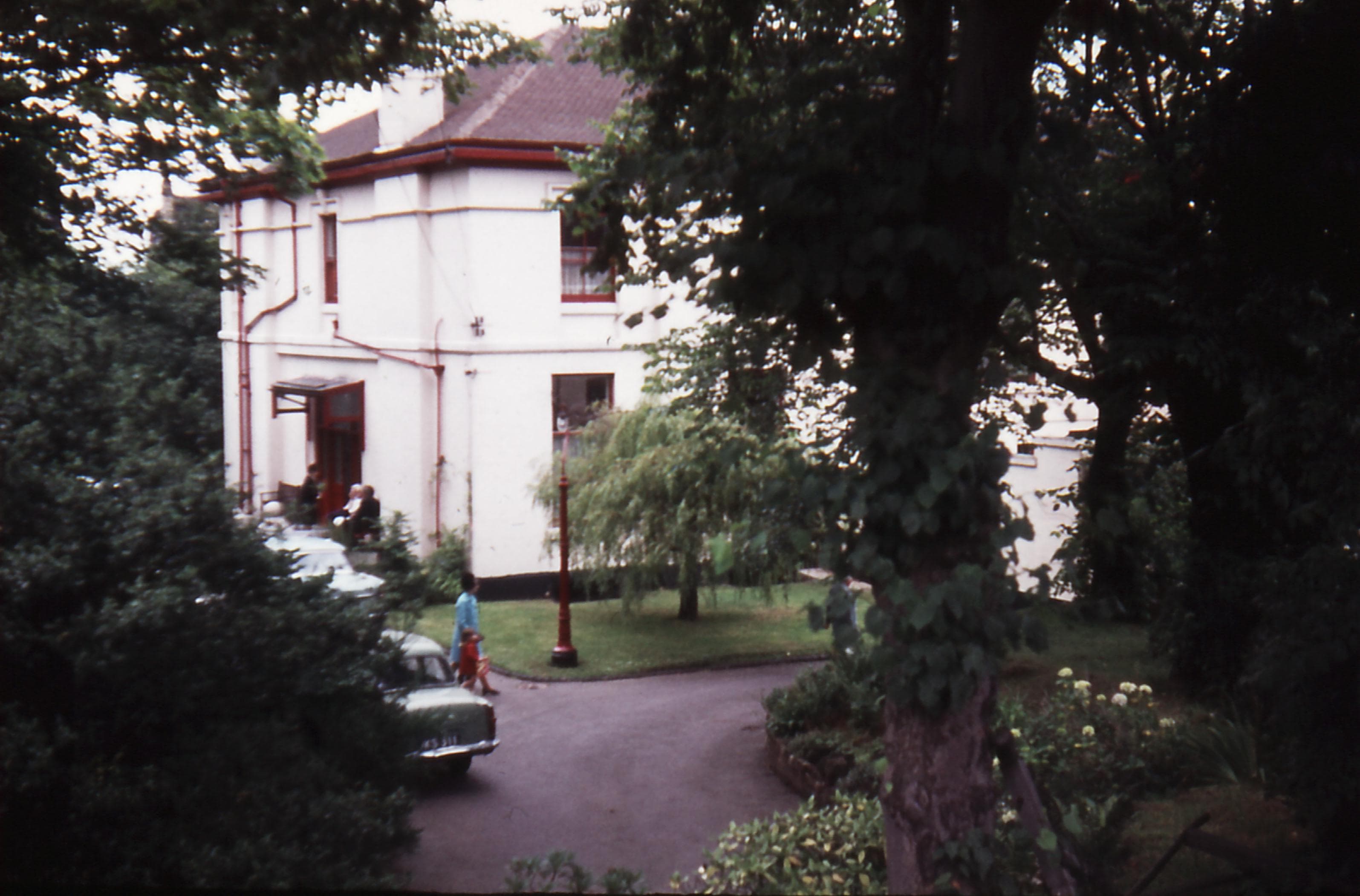 Image of the main Emmanuel Bible College building, looking down from the bank
