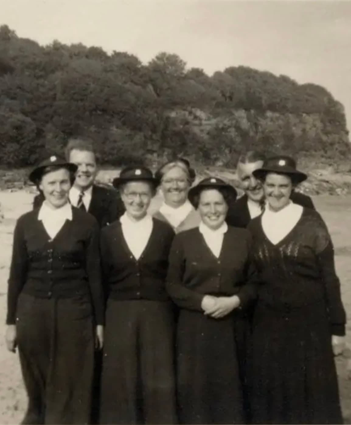 Old black and white image of a beach mission team